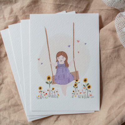 Ansichtkaart 'Meisje op schommel'